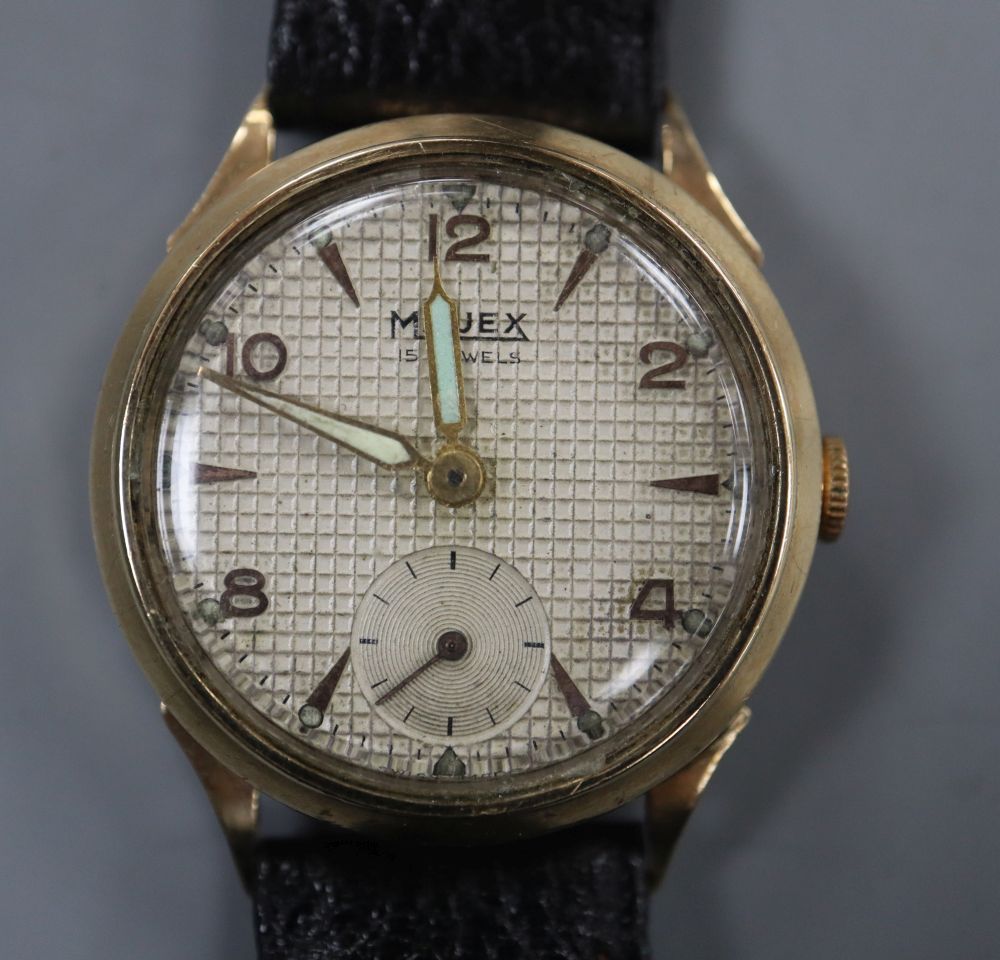 A gentlemans 1950s 9ct gold Majex manual wind wrist watch, on leather strap.